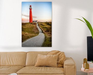 Path leading to a red lighthouse in the dunes  by Sjoerd van der Wal