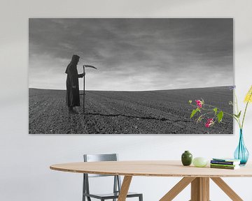 Figure with scythe in a field by marleen brauers