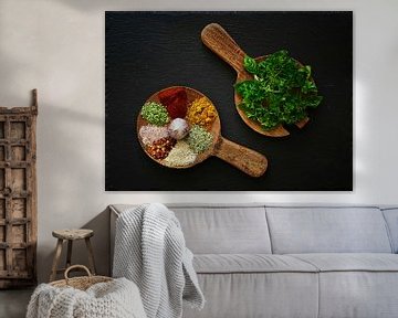 Cheerful still life with spices on wooden spoons .