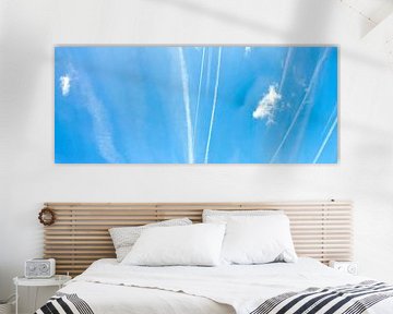 Cloud-like streaks across a blue sky by Lilly Wonderz