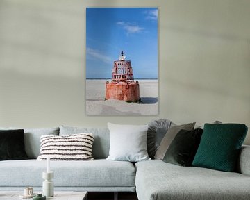 A beacon on the beach by Lydia
