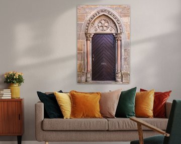 Stately and ornate wooden castle door by Dafne Vos