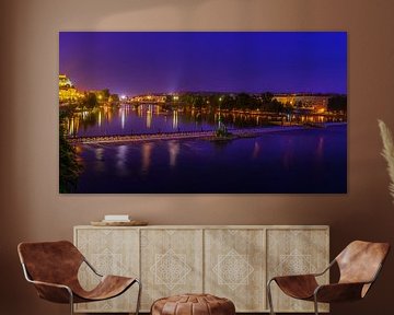 Night photo of Prague with view of the Danube and Legion Bridge by Rob Baken