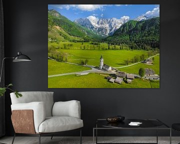 Zgornje Jezersko chuch in the valley aerial view during springtime