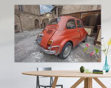 Old Fiat 500 in square in Bevagna, Italy by Joost Adriaanse