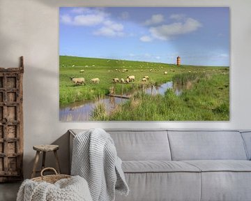 Flock of sheep near the Pilsum lighthouse in East Frisia
