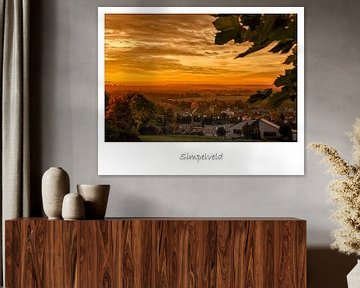 Poster van een zonsopkomst boven Simpelveld van John Kreukniet