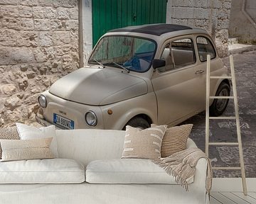 Old beige Fiat 500 in inner city of Ostuni, Italy
