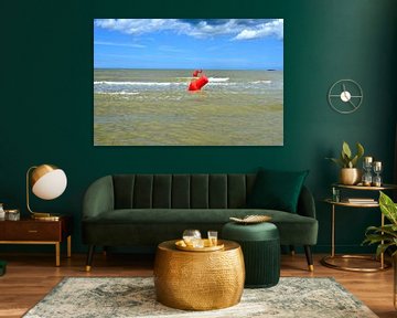 Red floating demarcation buoys at sea by Lilly Wonderz