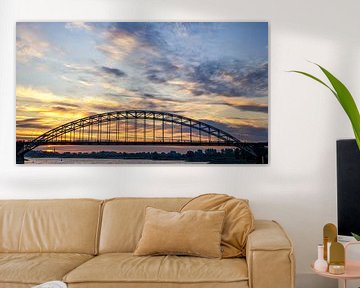 Sunrise over the River Waal and walkers by Lex Schulte