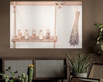 Photo of a wooden shelf with bottles and lavender. by Frans Scherpenisse