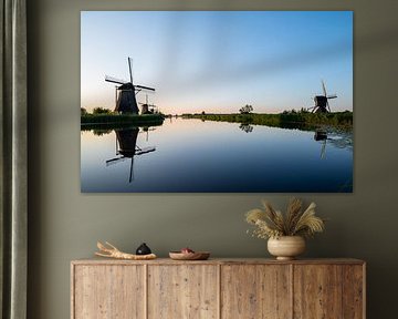 Windmills with reflections in the water by Erwin Pilon