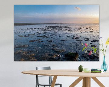 Low water on the mud flats near Holwerd during sunset by Evert Jan Luchies