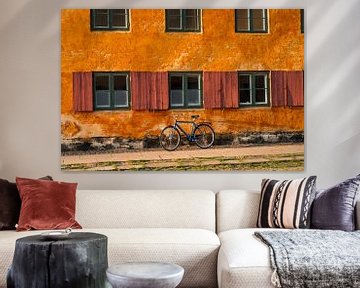 Colorful old wall with bicycle by Robbert Frank Hagens