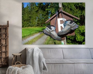 A pair of hiking boots on a signpost on the Rennsteig in the Thuringian Forest by Animaflora PicsStock