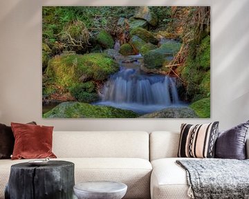 Waterfall with rocks overgrown with moss by Cor Brugman