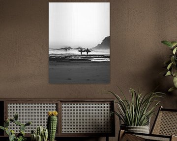 Surfers On The Beach In Black And White by Dagmar Pels