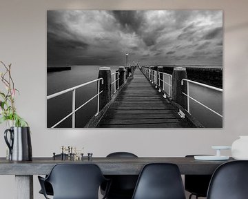 Jetty with white fence Keizersbolwerk Vlissingen in black and white