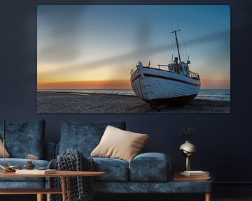 Fishing boats on the Danish beach at sunset. by Menno Schaefer