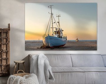 Fishing boats on the Danish beach at sunset.