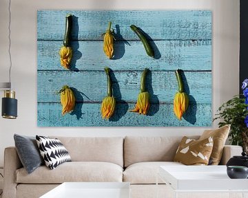 Courgette flowers on wooden boards by Ulrike Leone