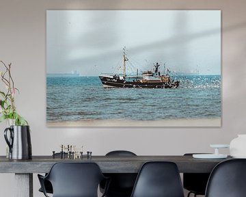 Fishing boat at Scheveningen with lots of seagulls by Anne Zwagers