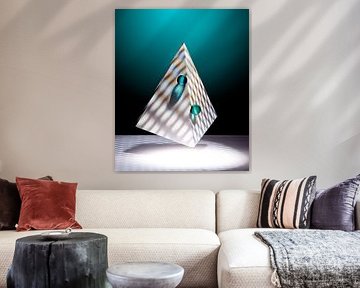 Floating pyramid, two green marbles on a darkgreen background