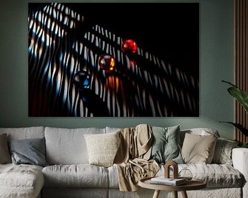 Three marbles with lines of light