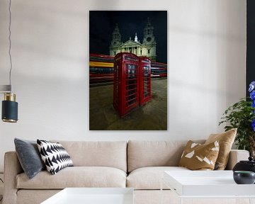 English telephone booths with the movement of an English double-decker bus behind them by Bob Janssen