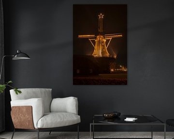 A Dutch windmill with Christmas lights by Tonko Oosterink