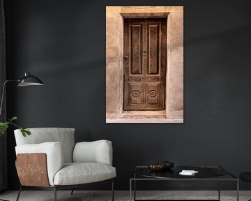 Beautiful old Spanish wooden door with carvings