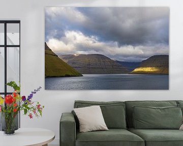 View of the rocks of the Faroe Islands with clouds by Rico Ködder