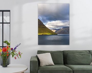 View of the rocks of the Faroe Islands with clouds by Rico Ködder