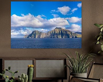 View of the rocks of the Faroe Islands with clouds by Rico Ködder