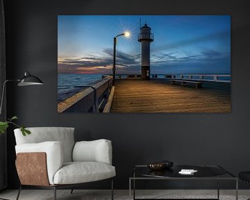 Pier in Middelkerke Belgium in the evening with beautiful atmosphere by Rob van der Teen