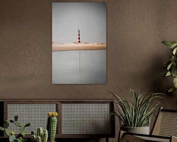 The lighthouse of beautiful Ameland in reflection by Graphx