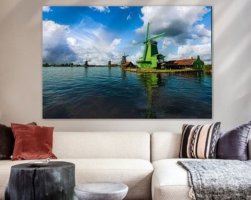 Zaanse Schans with the green mill on the water and windmills in the background. by Brian Morgan