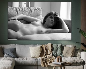 Dreamy naked woman on a sofa by Werner Lerooy