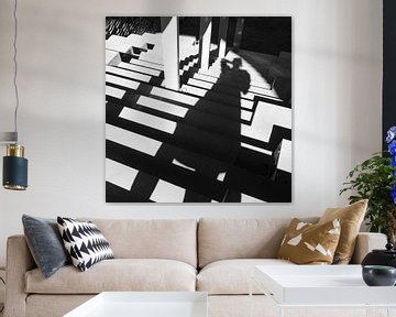 Modern portrait of woman at stairs in black and white by Helene van Rijn