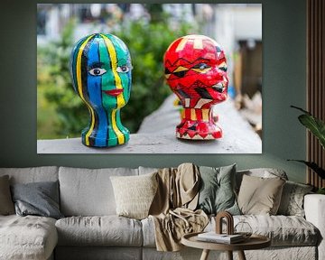 Multicoloured sculpted heads by Wim Stolwerk