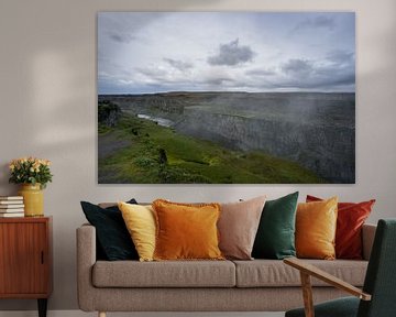 Iceland - Giant canyon of detifoss waterfall with river flowing by adventure-photos