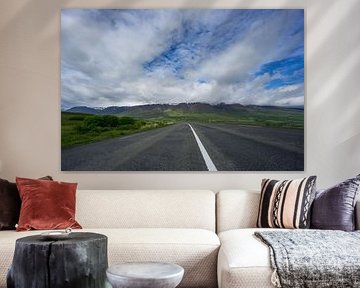 Iceland - Highway curve in front of majestic green mountain chain by adventure-photos