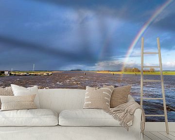 Regenboog boven het hoge water van het Reitdiep in Groningen van Evert Jan Luchies