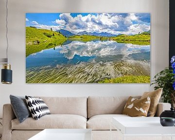 Grasses and cloud towers at Krummschnabelsee lake by Christa Kramer