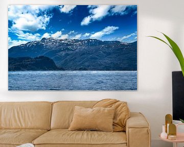 Western Cape in Norway. Fjord and sea with clouds and mountains on the coast by Martin Köbsch