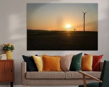 Wind turbine at sunset on a meadow by Martin Köbsch