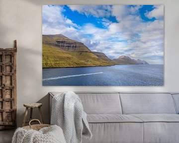 View of the rocks of the Faroe Islands with clouds by Rico Ködder