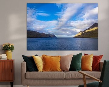 View of the rocks of the Faroe Islands with clouds by Rico Ködder