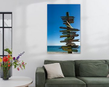 USA, Florida, Beautiful ocean behind huge sign with multiple directions at the beach of key west by adventure-photos