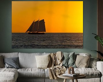 USA, Florida, Burning orange sky after sunset with majestic sailboat by adventure-photos